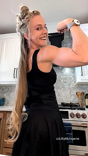 Carmilla Vess hitting a gothy bicep flex'