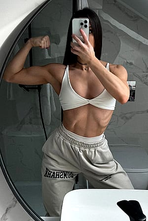 biceps and abs flexing'